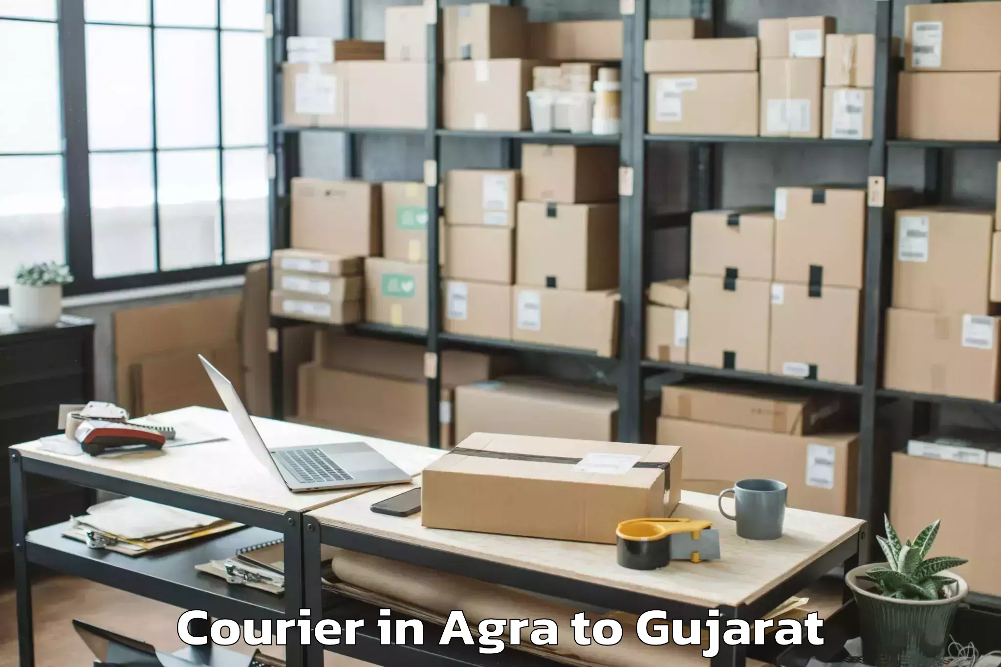 Book Agra to Jambughoda Courier Online